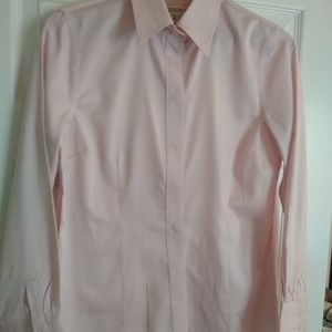 Women's pink button down shirt.